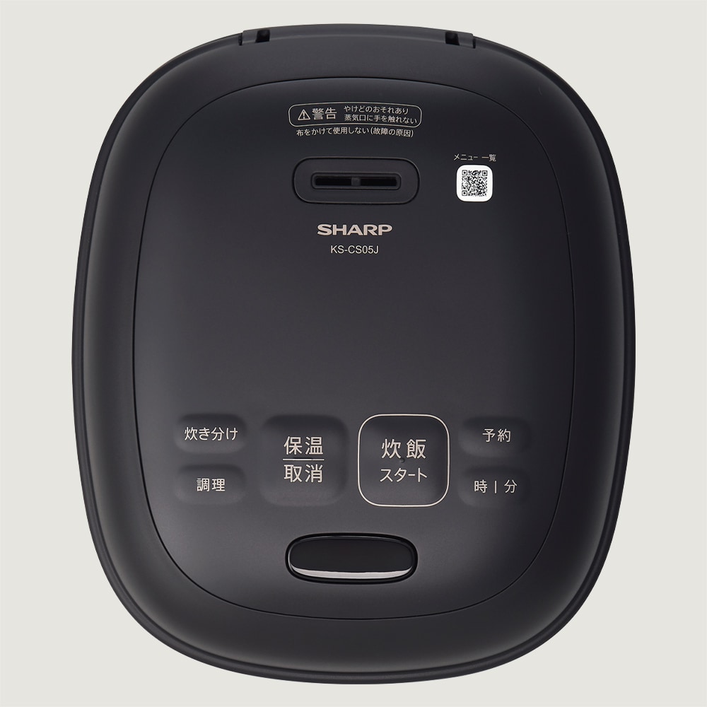 操作部とオープンボタンがある本体天面のイメージ。